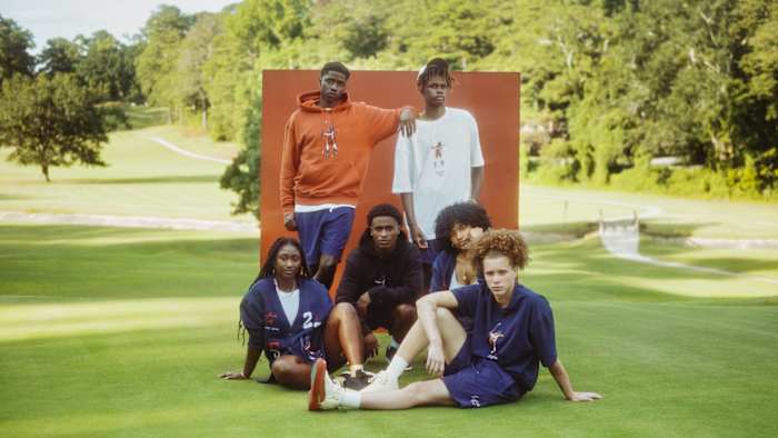 Group shot of golfers wearing Jordan Brand attire.